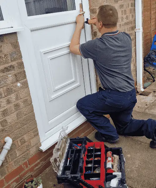 wolverhampton locksmith (jr Locksmith) fixing a lock on a upvc door